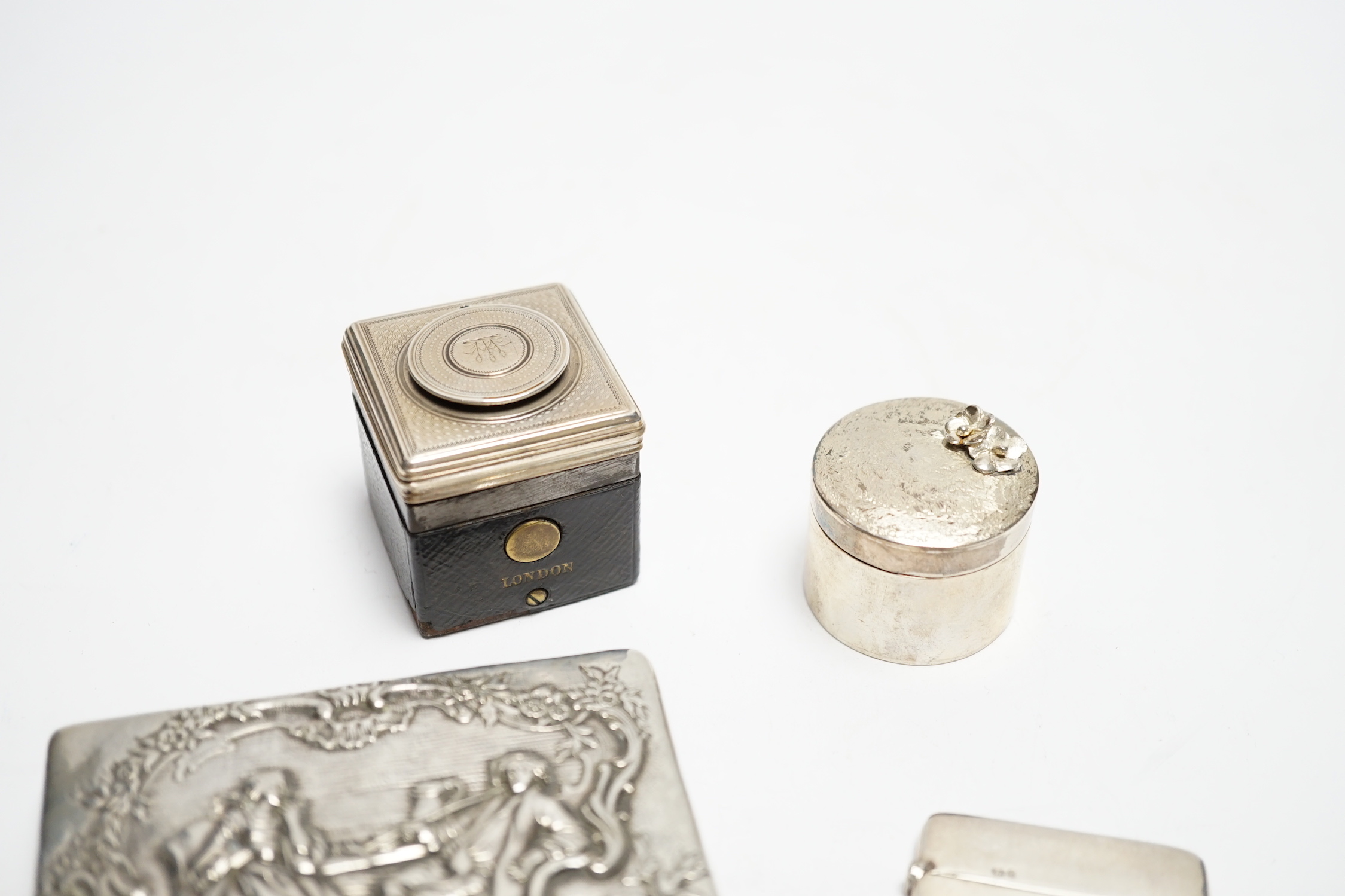 A German embossed 800 standard white metal snuff box, 87mm a silver card case, a modern silver drum shaped box(a.f.) and a silver mounted inkwell .